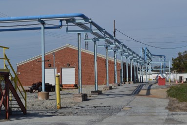 This 6,000 square foot warehouse is located along Ellerslie Road outside the security perimeter. Rail sidings are located along the building‚Äôs western boundary. A new steel roof was installed in 2012.